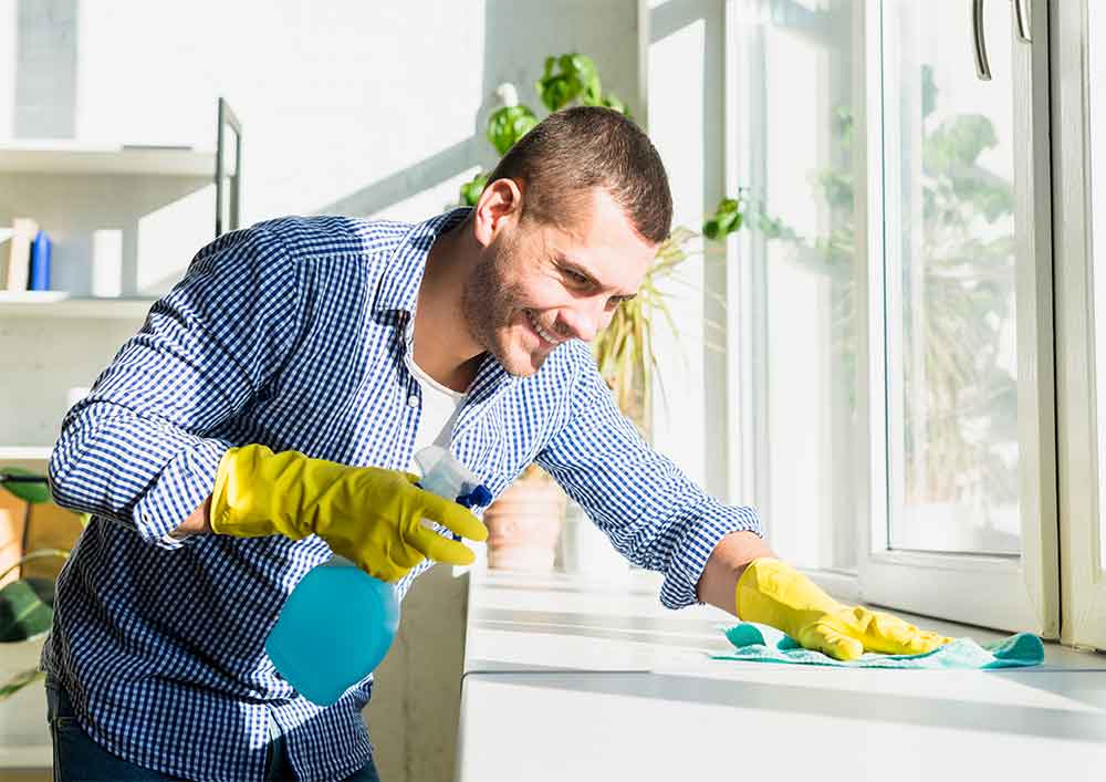 Man Cleaning His Home